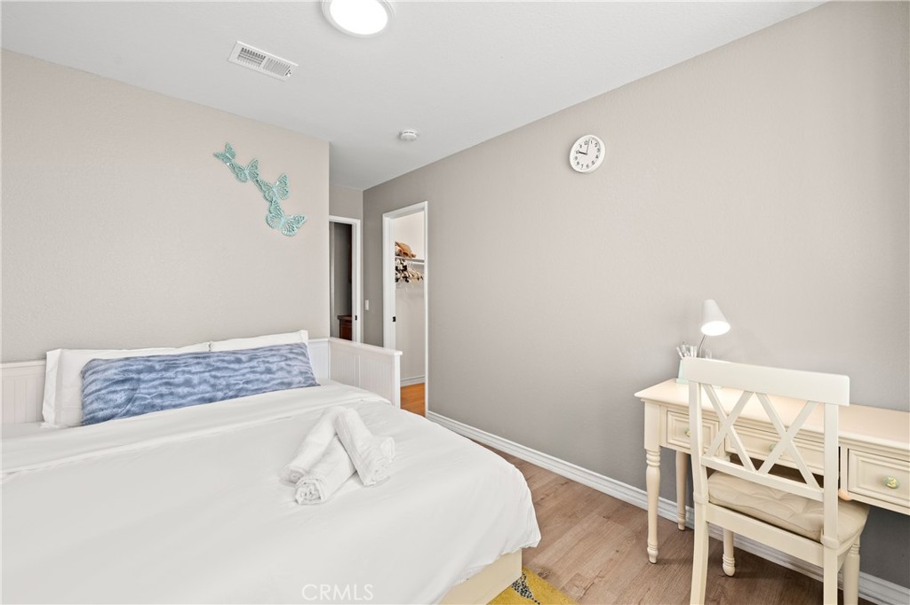 6933 Stanislaus Place Rancho Cucamonga, CA 91701 - Photo 33 of 54 a bedroom with a bed and a chair in it