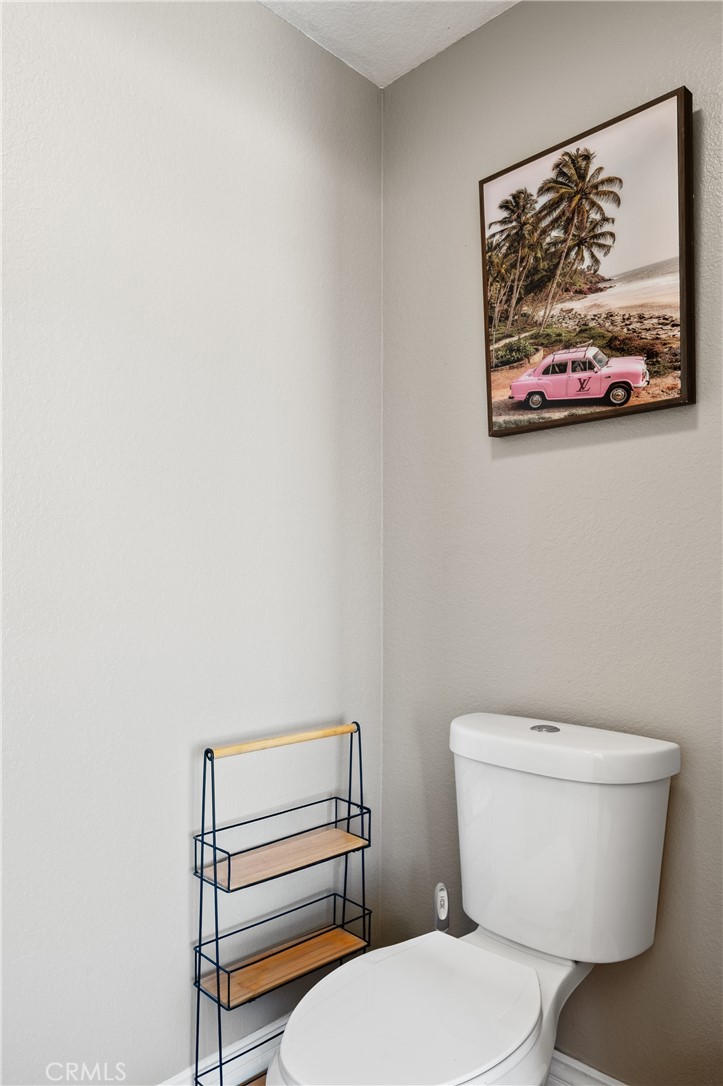 6933 Stanislaus Place Rancho Cucamonga, CA 91701 - Photo 40 of 54 a white toilet sitting next to a shower