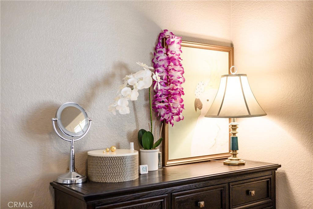 6933 Stanislaus Place Rancho Cucamonga, CA 91701 - Photo 52 of 54 a table with a vase and flowers on it