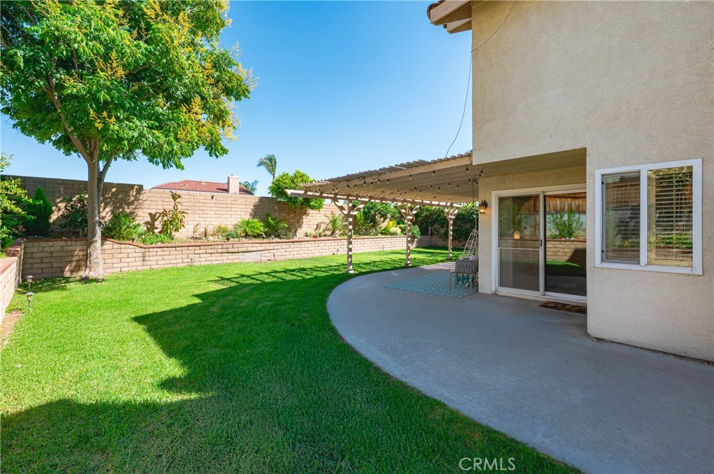 6933 Stanislaus Place Rancho Cucamonga, CA 91701 - Photo 54 of 54 a view of a house with a yard and a garden