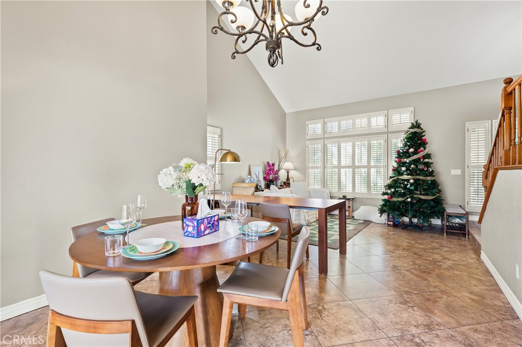 6933 Stanislaus Place Rancho Cucamonga, CA 91701 - Photo 9 of 54 a view of a dining room with furniture window and wooden floor