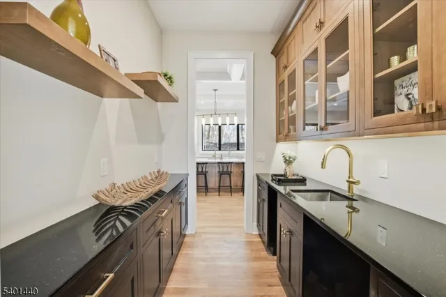 a kitchen with stainless steel appliances granite countertop a stove and a sink