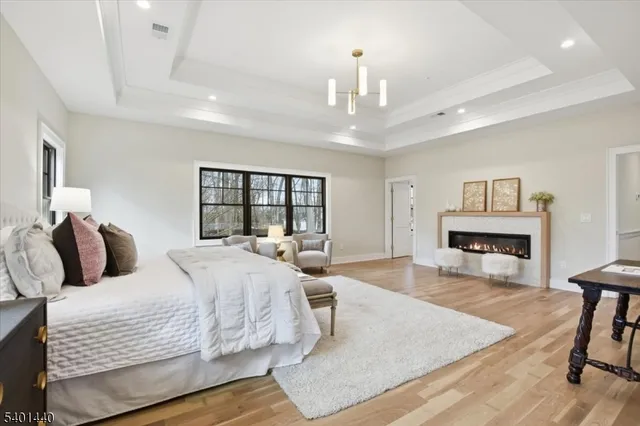 a bathroom with a tub sink shower and mirror