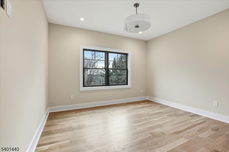 336 Fairmount Avenue Chatham, NJ 07928 - Photo 24 of 45 wooden floor in an empty room with a window