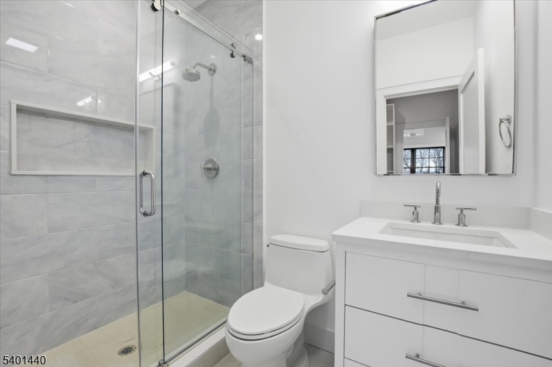 336 Fairmount Avenue Chatham, NJ 07928 - Photo 25 of 45 a bathroom with a toilet sink vanity and shower