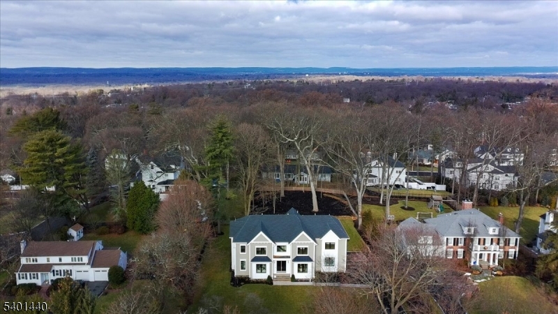 336 Fairmount Avenue Chatham, NJ 07928 - Photo 39 of 45 a view of a lake with a mountain in the background