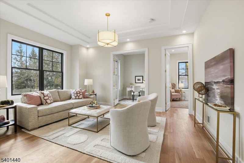 336 Fairmount Avenue Chatham, NJ 07928 - Photo 5 of 45 a living room with furniture a wooden floor and a large window