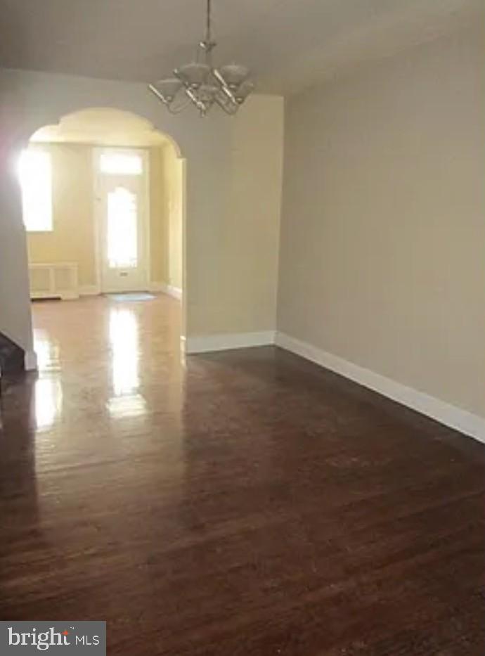 192 Conarroe Street Philadelphia, PA 19127 - Photo 2 of 7 an empty room with wooden floor and windows