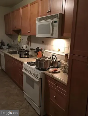 a kitchen with a stove and a microwave