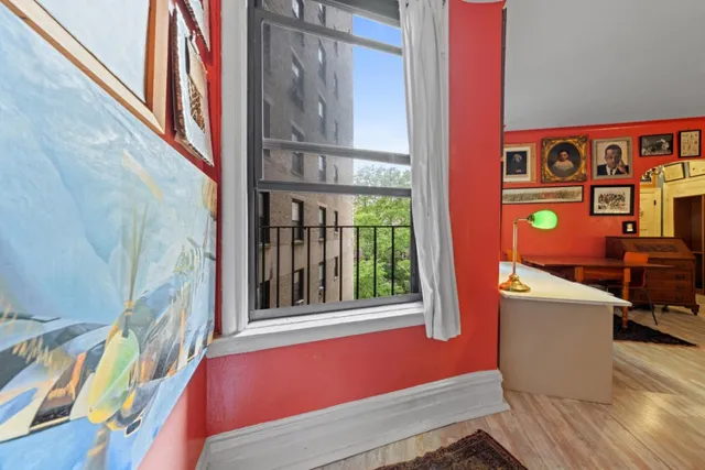 a view of an entryway with wooden floor and windows