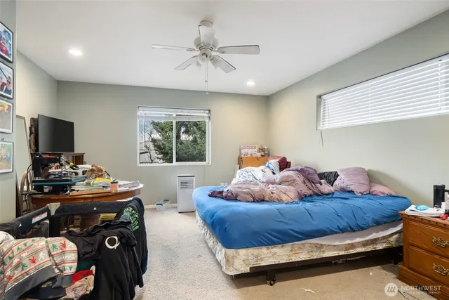 a bed room with furniture and a chandelier