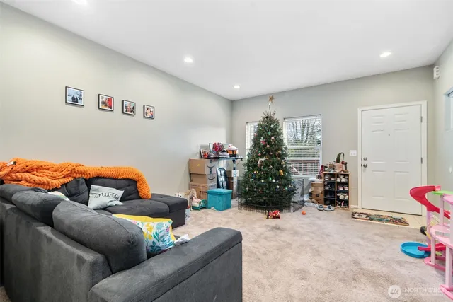 a kitchen with stainless steel appliances granite countertop a sink a stove and a refrigerator