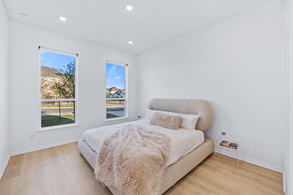 1953 Varese Path Leander, TX 78641 - Photo 14 of 36 a bedroom with a bed and a window