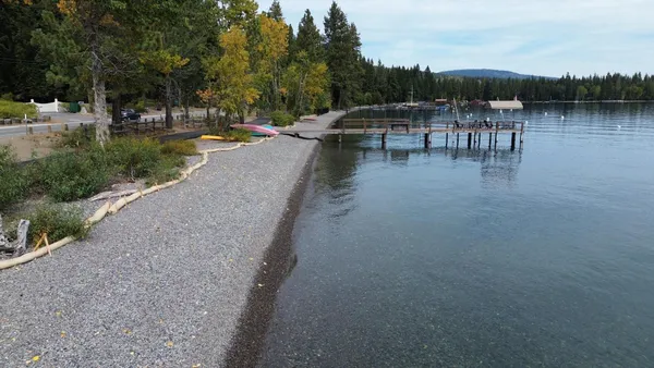a view of a lake with sitting area