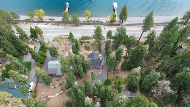 an aerial view of multiple houses with yard