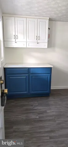 a kitchen with washing machine and a sink