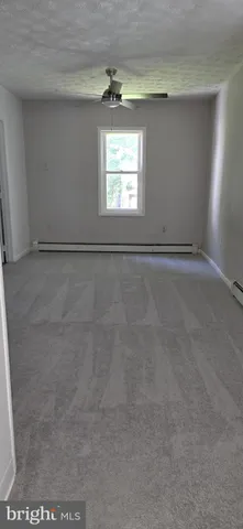 a bathroom with a sink toilet and mirror