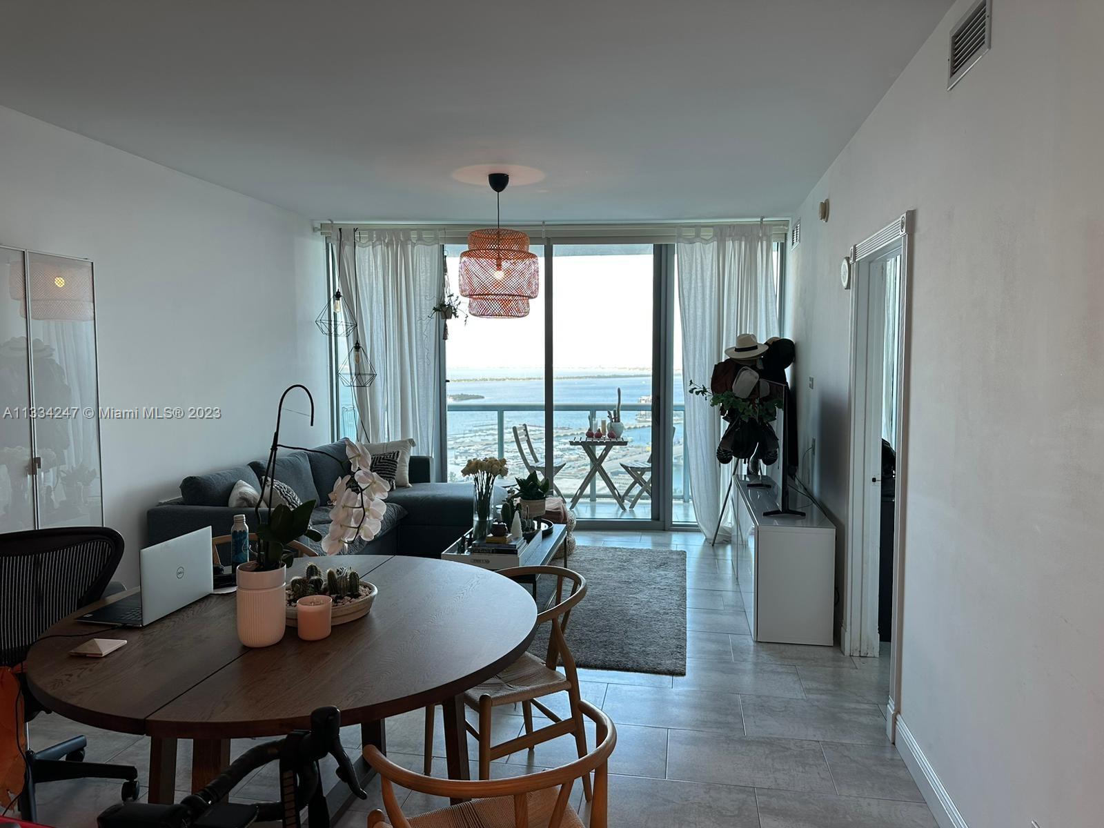 888 Biscayne Boulevard, Unit 3611 Miami, FL 33132 - Photo 11 of 13 a view of a dining room and livingroom view