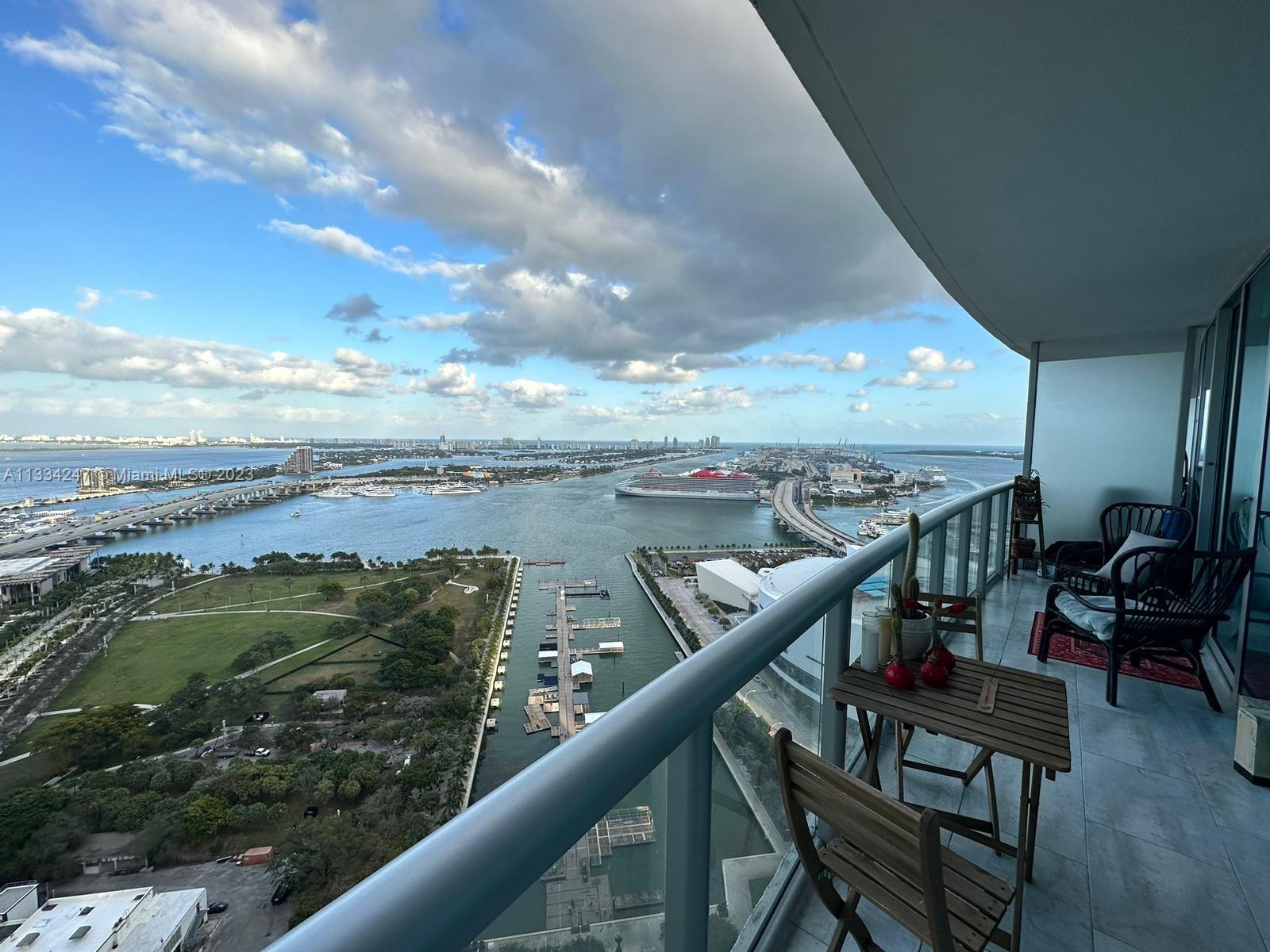 888 Biscayne Boulevard, Unit 3611 Miami, FL 33132 - Photo 2 of 13 a view of a balcony with furniture