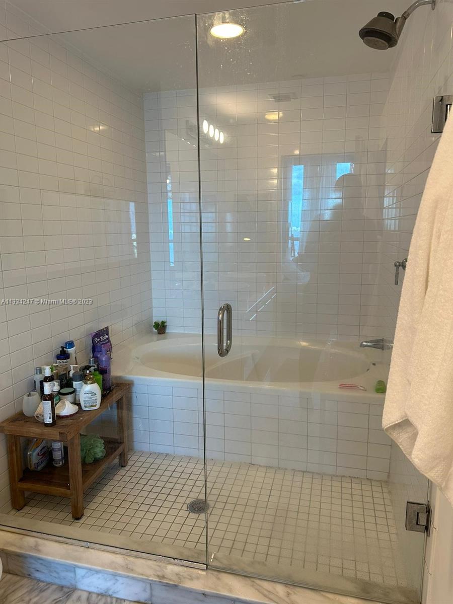 888 Biscayne Boulevard, Unit 3611 Miami, FL 33132 - Photo 7 of 13 a bathroom with a shower