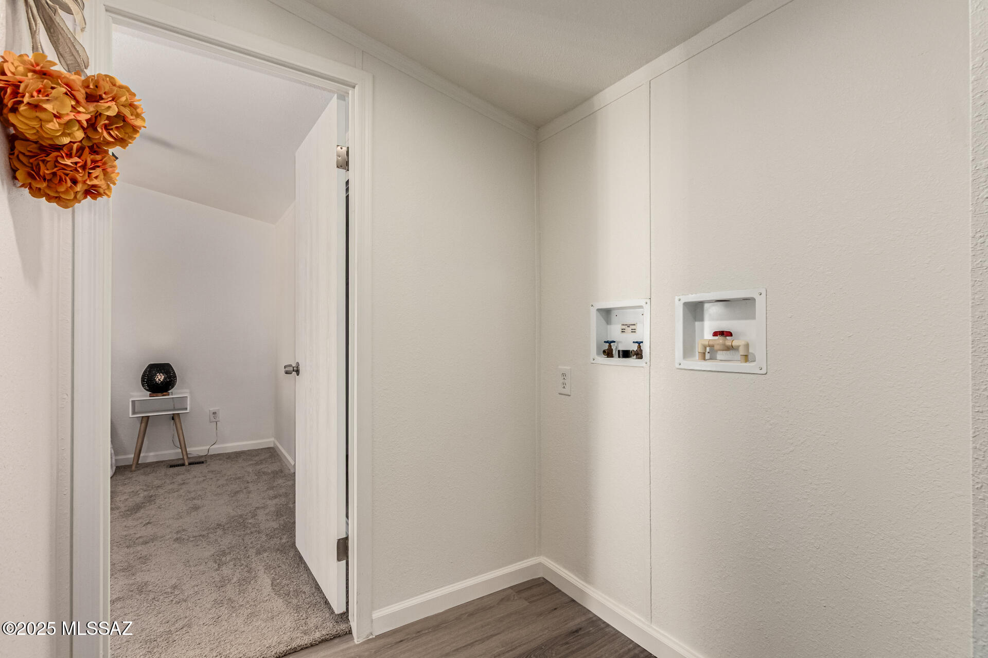 8401 South Kolb Road, Unit 94 Tucson, AZ 85756 - Photo 23 of 24 a view of a hallway with wooden floor and a bathroom