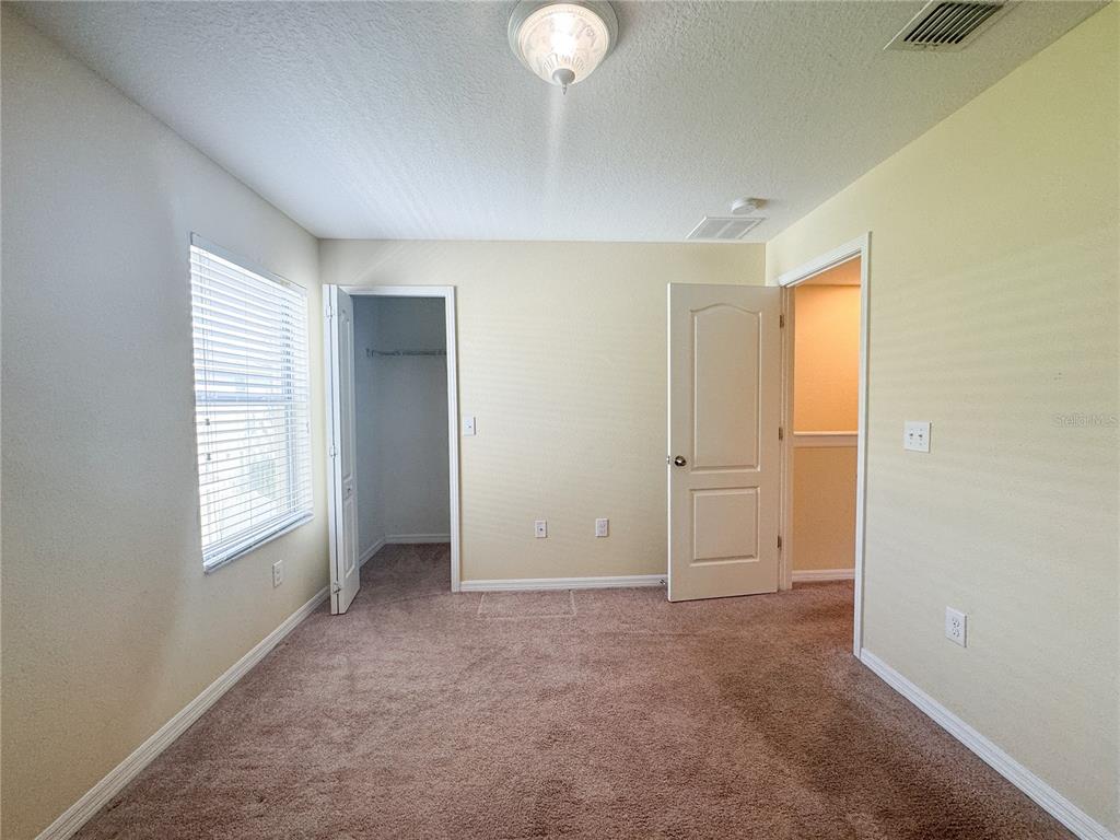 8542 Gablebend Way, Unit 8542 Tampa, FL 33647 - Photo 13 of 14 a view of an empty room with window and closet area