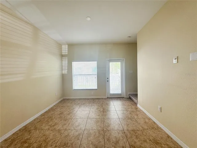 a view of an empty room and window