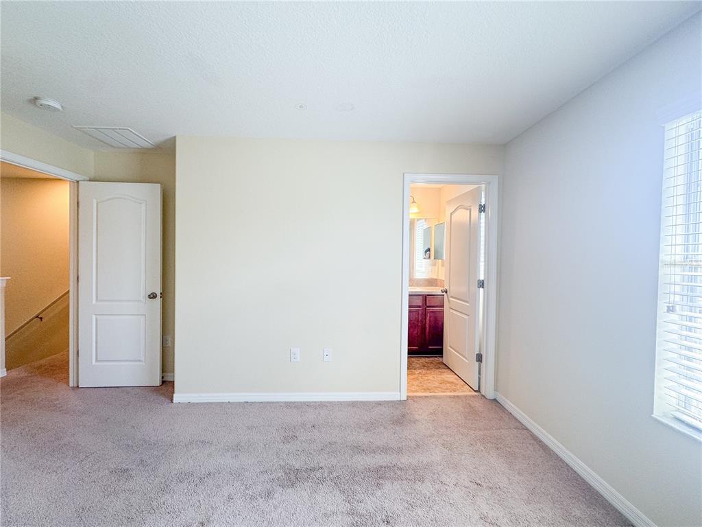 8542 Gablebend Way, Unit 8542 Tampa, FL 33647 - Photo 10 of 14 an empty room with windows and closet