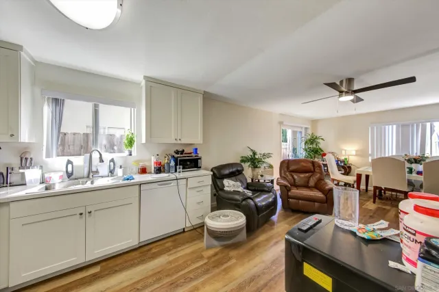 a kitchen with stainless steel appliances a refrigerator sink and cabinets