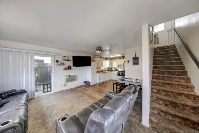 a view of a dining room with furniture and window