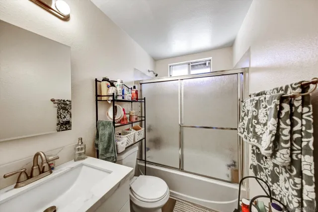 a bathroom with a sink and shower