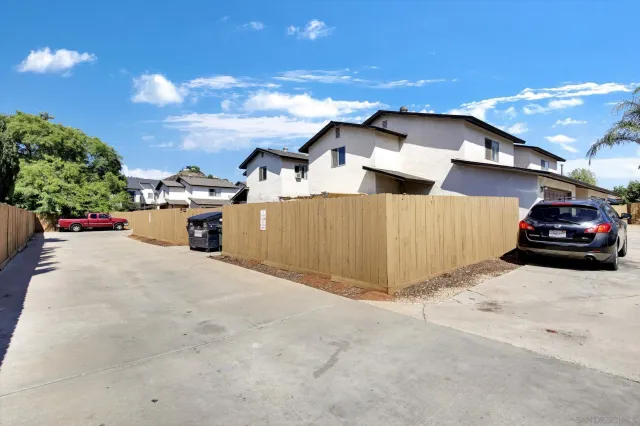 a view of a car park in front of house