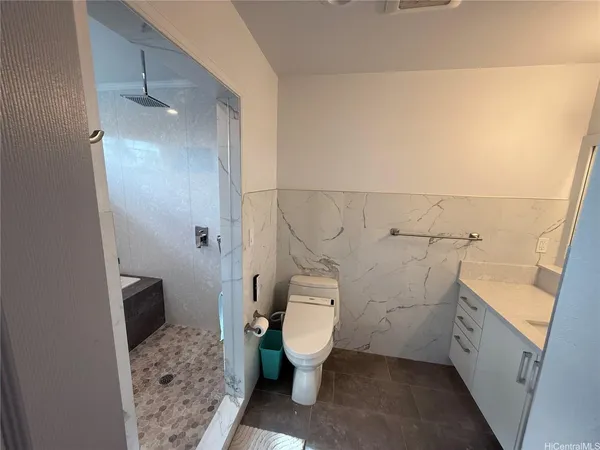 a bathroom with a sink and toilet