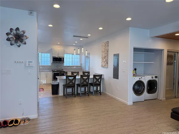 a view of a kitchen and dining room