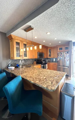 a living room with furniture dining room and wooden floor