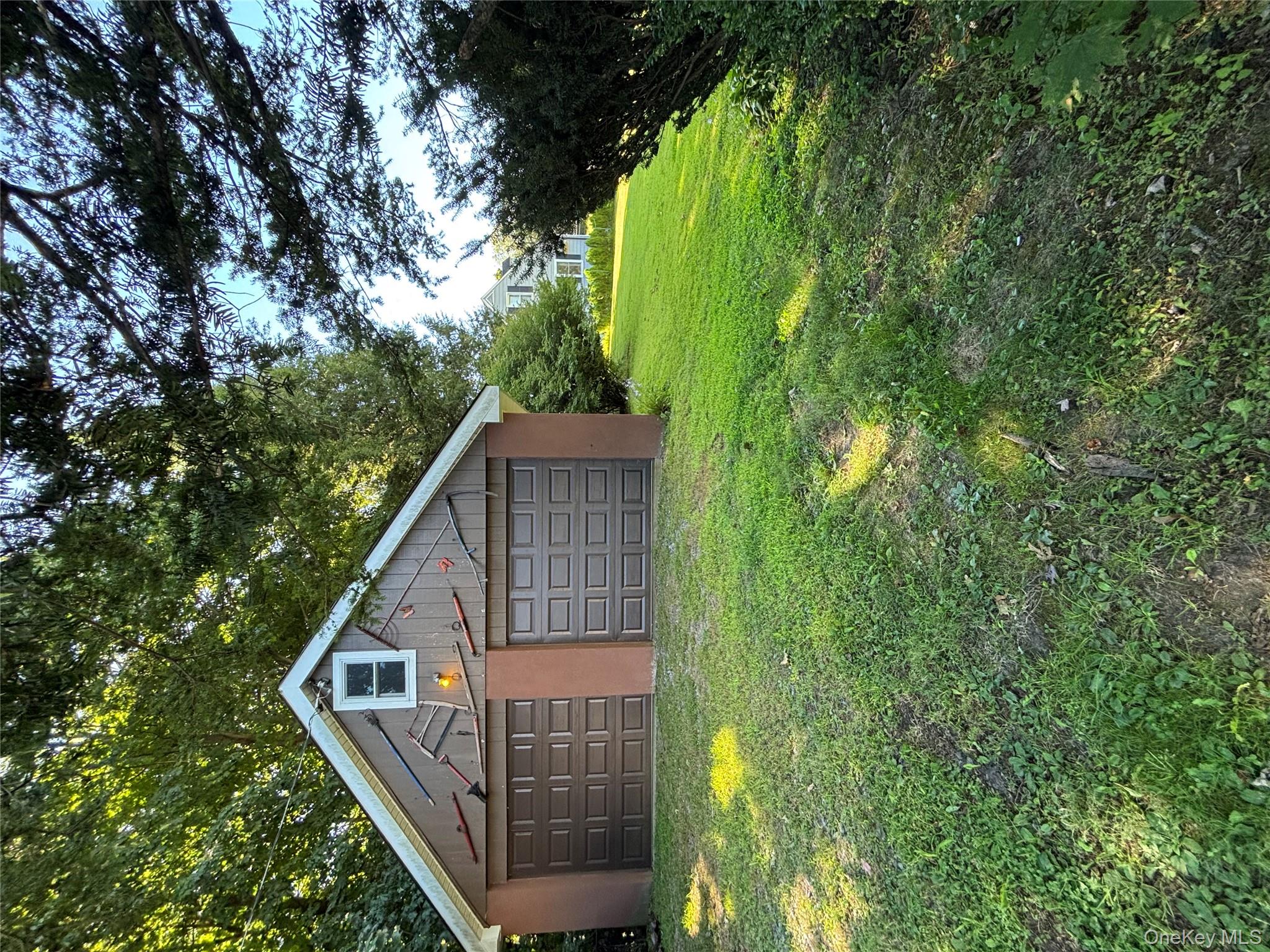 4 Lottie Road Carmel, NY 10512 - Photo 15 of 16 a dirt road with a big yard and large trees