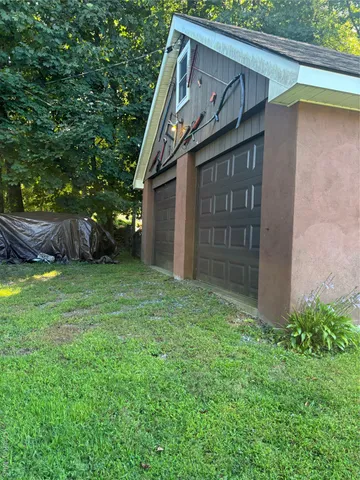 a backyard of a house with lots of green space