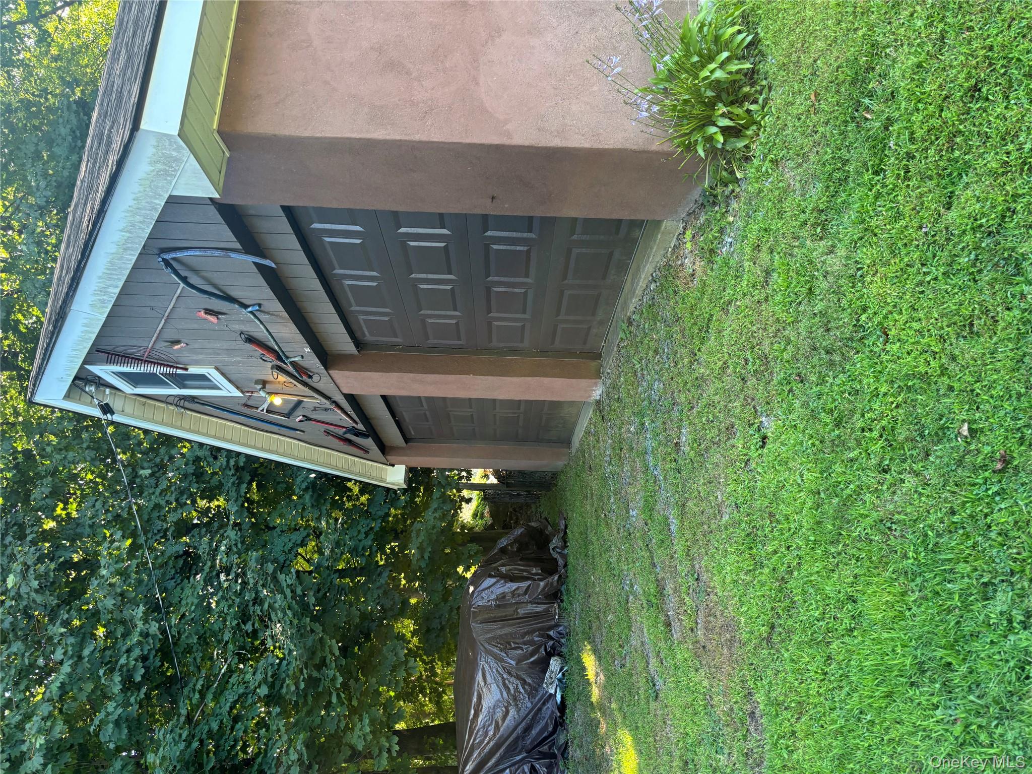 4 Lottie Road Carmel, NY 10512 - Photo 16 of 16 a backyard of a house with lots of green space