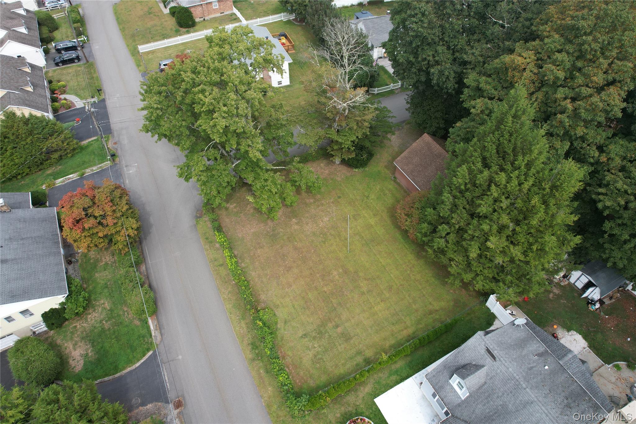 4 Lottie Road Carmel, NY 10512 - Photo 4 of 16 an aerial view of a house with a yard and garden