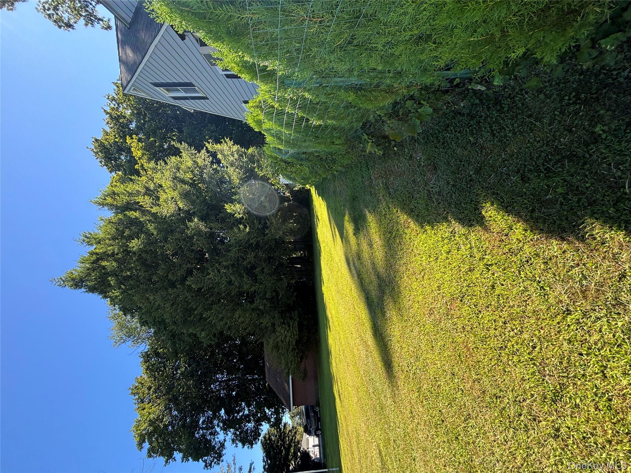 4 Lottie Road Carmel, NY 10512 - Photo 8 of 16 a view of an outdoor space and swimming pool