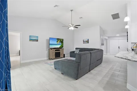 a living room with furniture and a table