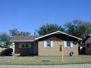 4607 South Lamar Street Amarillo, TX 79110 - Photo 1 of 1 a front view of a house with a yard