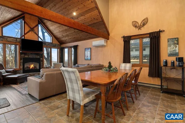 a dining room with furniture and a fireplace
