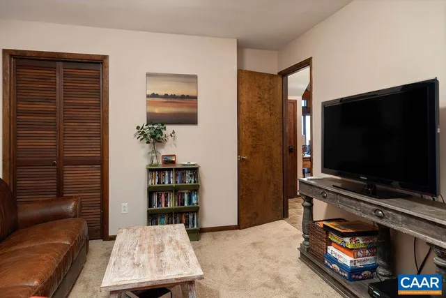 a view of a dining room with furniture and window