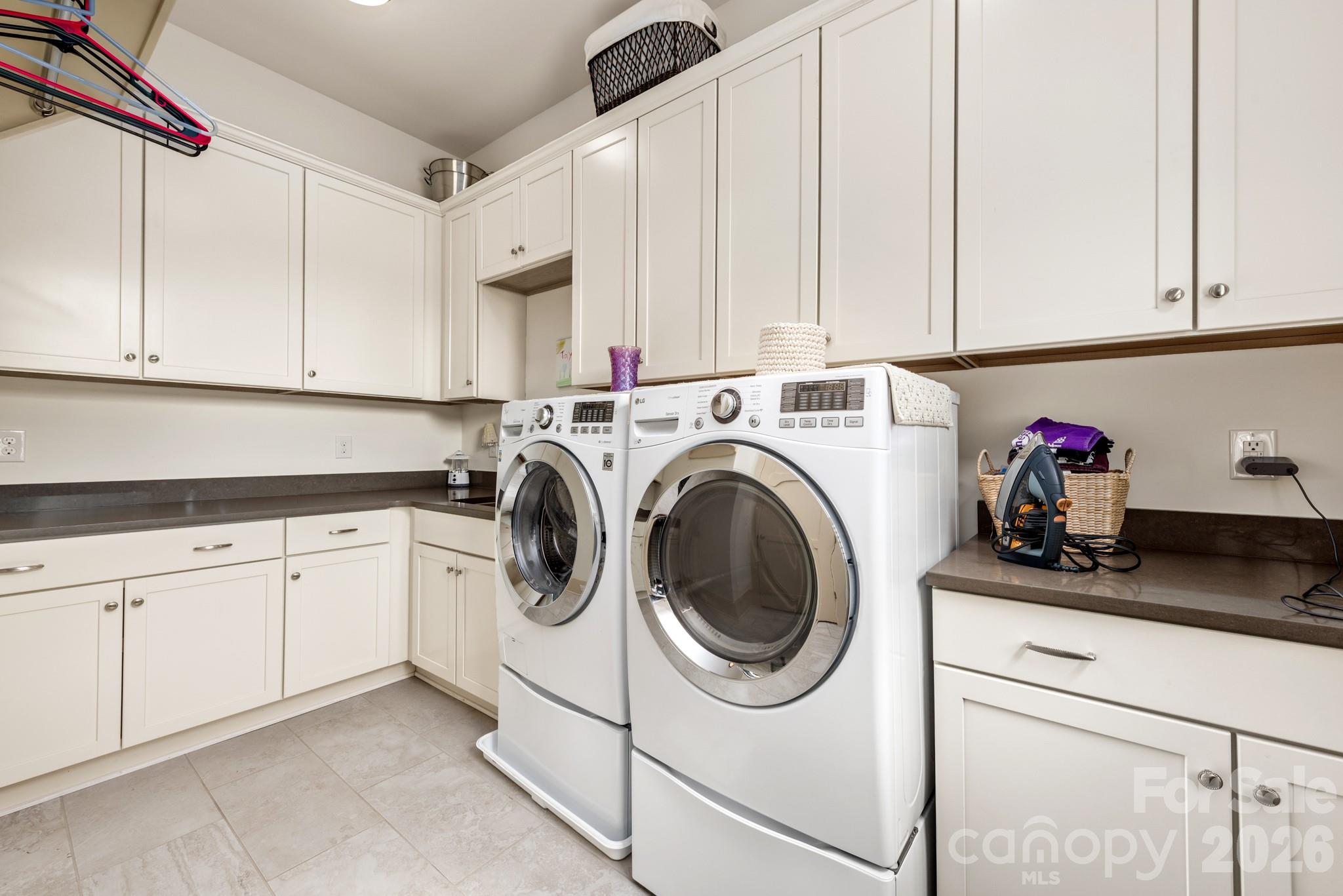 18321 Rosapenny Road Charlotte, NC 28278 - Photo 17 of 40 a kitchen with white cabinets and white appliances