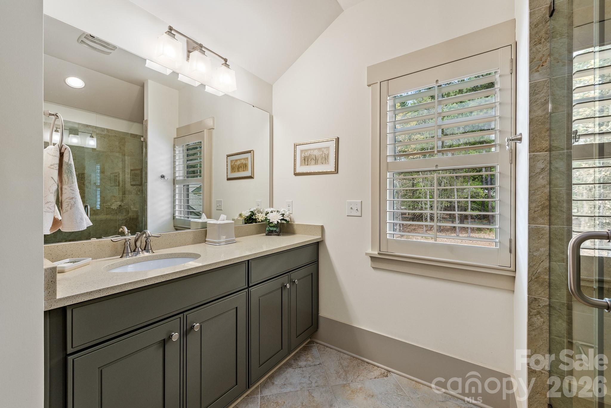 18321 Rosapenny Road Charlotte, NC 28278 - Photo 25 of 40 a bathroom with a sink double vanity and a mirror