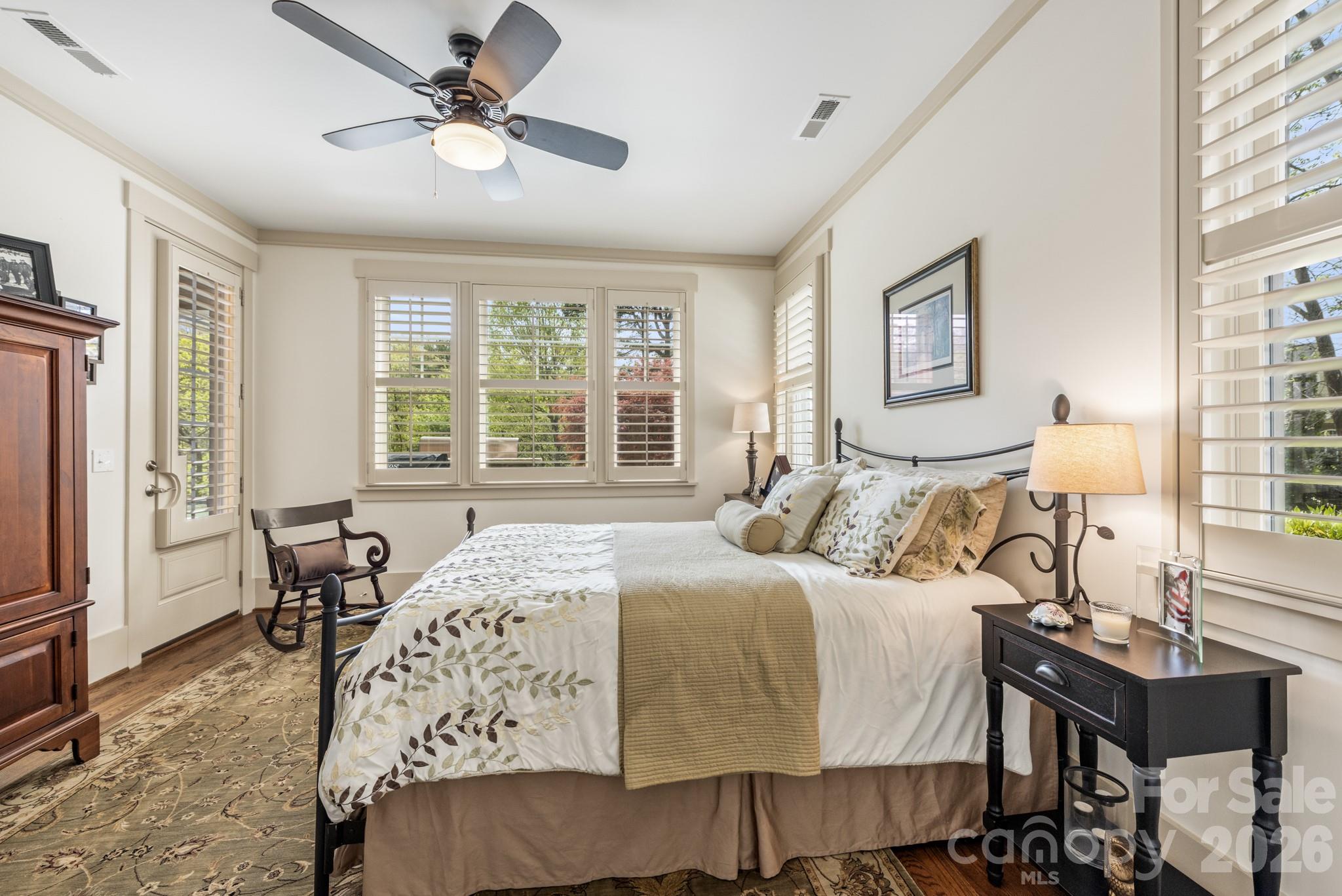 18321 Rosapenny Road Charlotte, NC 28278 - Photo 27 of 40 a bedroom with a bed and a table with rug