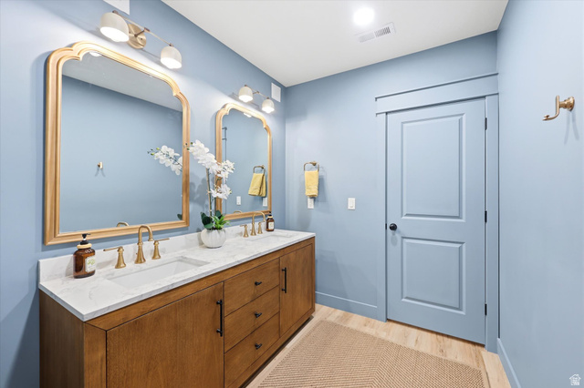 283 North 500 West Mapleton, UT 84664 - Photo 73 of 102 Bathroom with double vanity and light wood-style floors.