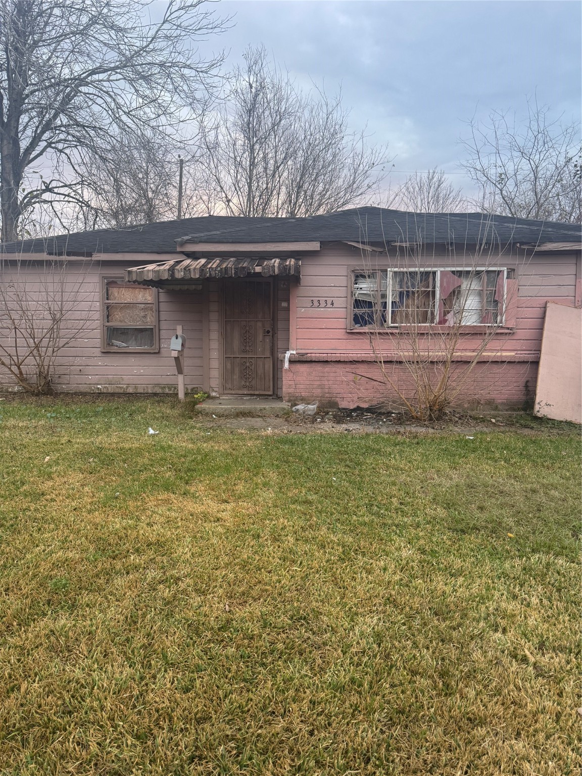 3334 Dulcrest Street Houston, TX 77051 - Photo 2 of 14 a front view of a house with a yard