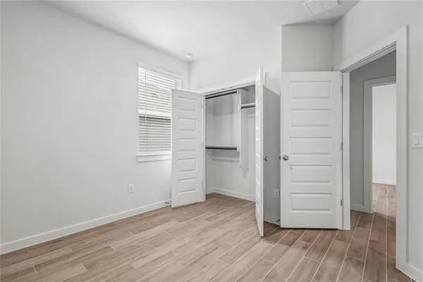 an empty room with wooden floor